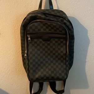 Black and grey checkered backpack